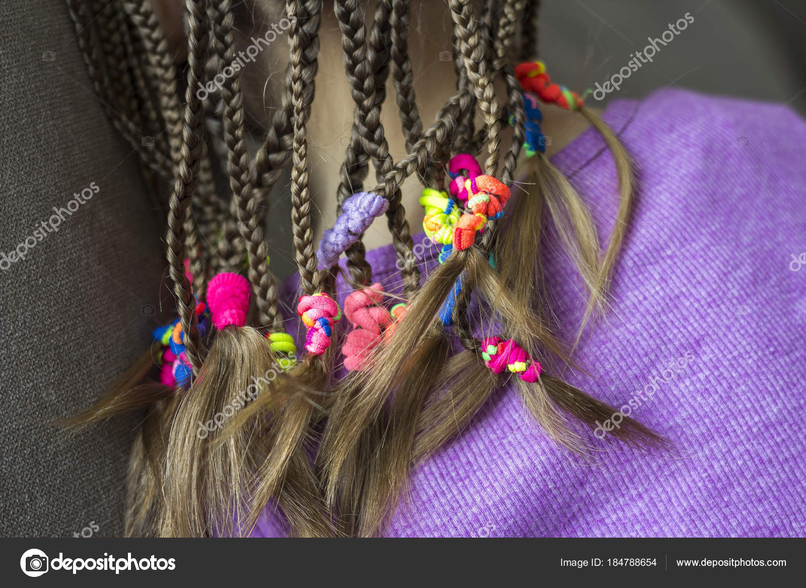 Close up of braid hair of little girl with colorful rubber bands Stock  Photo by ©bilanol.i.ua 184788654